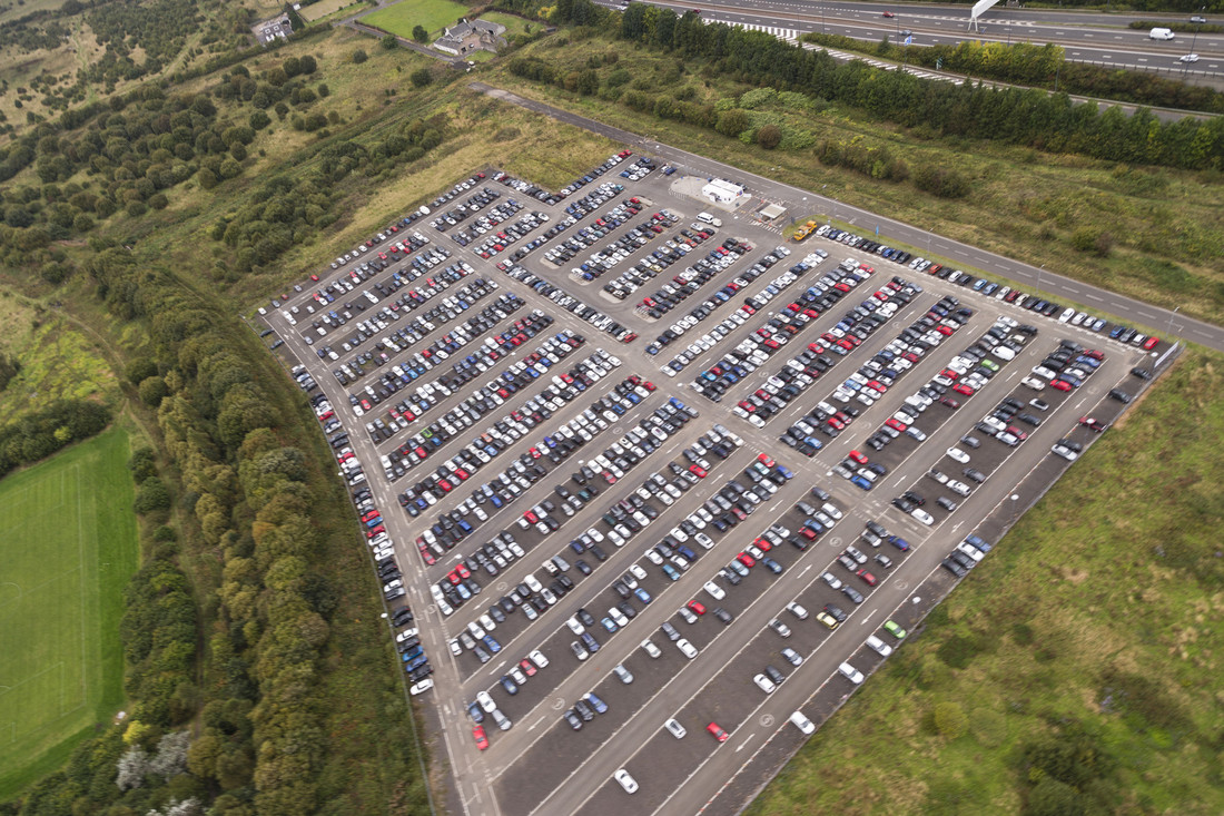 Aerial top-down view of Gatwick Airport car park showing rows of vehicles and organised parking infrastructure.