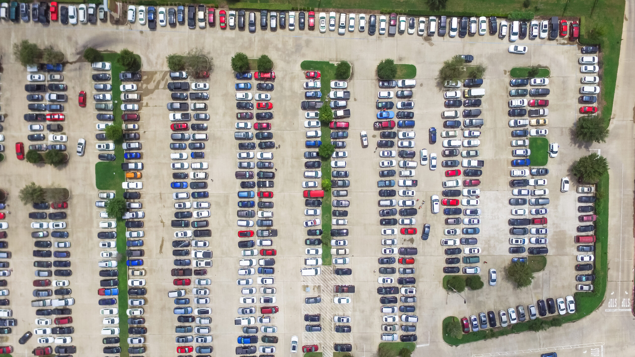 Aerial top-down view of Gatwick Airport car park showing rows of vehicles and organised parking infrastructure.