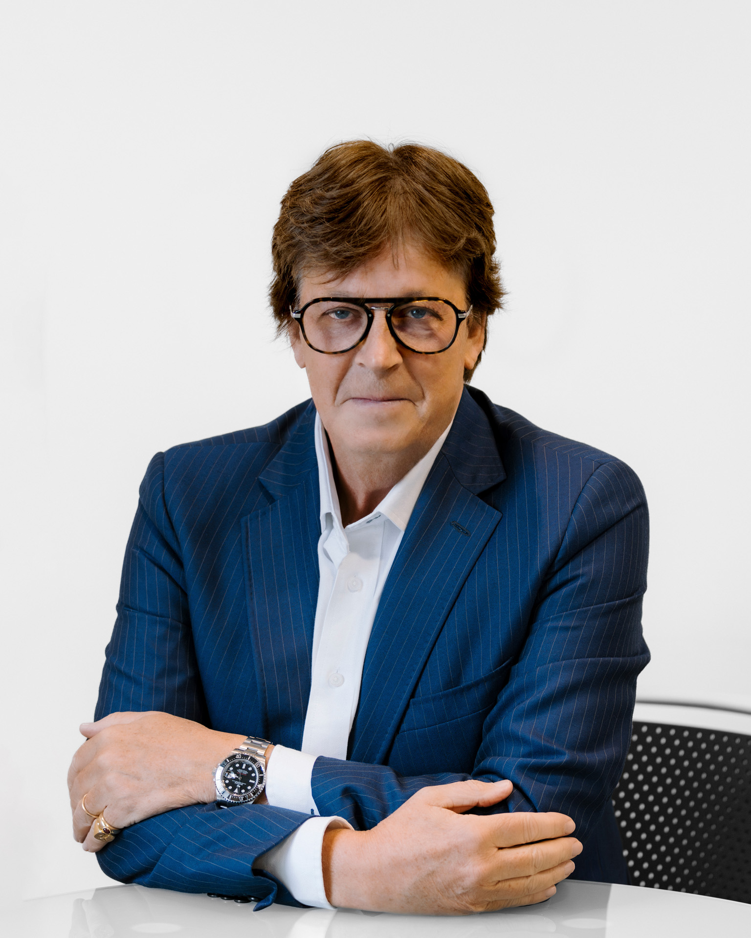 Michael Clavell-Bate, senior legal expert at LendFirst, seated in a blue pinstripe suit with a white shirt, offering trusted and pragmatic lending advice.
