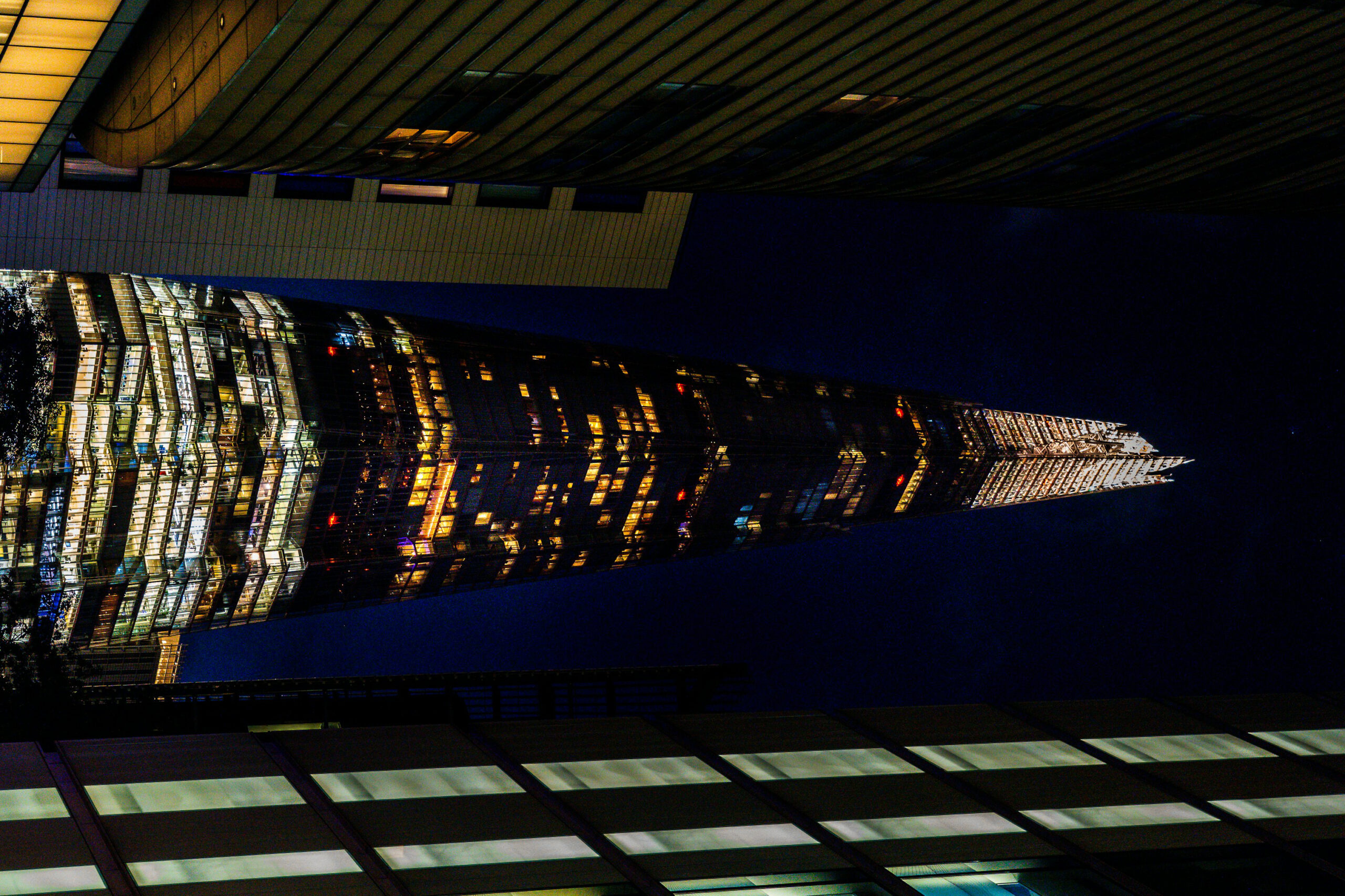 The Shard in London illuminated at night, showcasing its glass façade and skyline prominence.